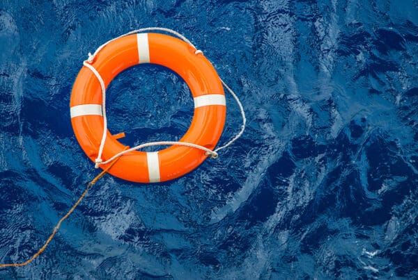 Universal Life Insurance - Safety Equipment, Life Buoy or Rescue Buoy Floating on Sea to Rescue People From Drowning Man.